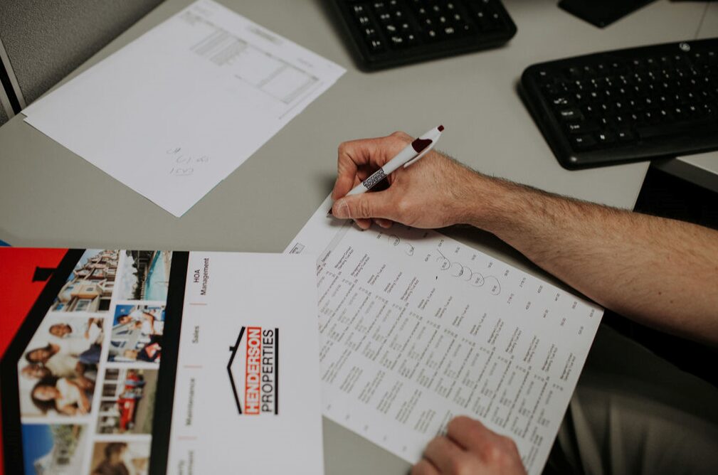 Professional property management team reviewing records